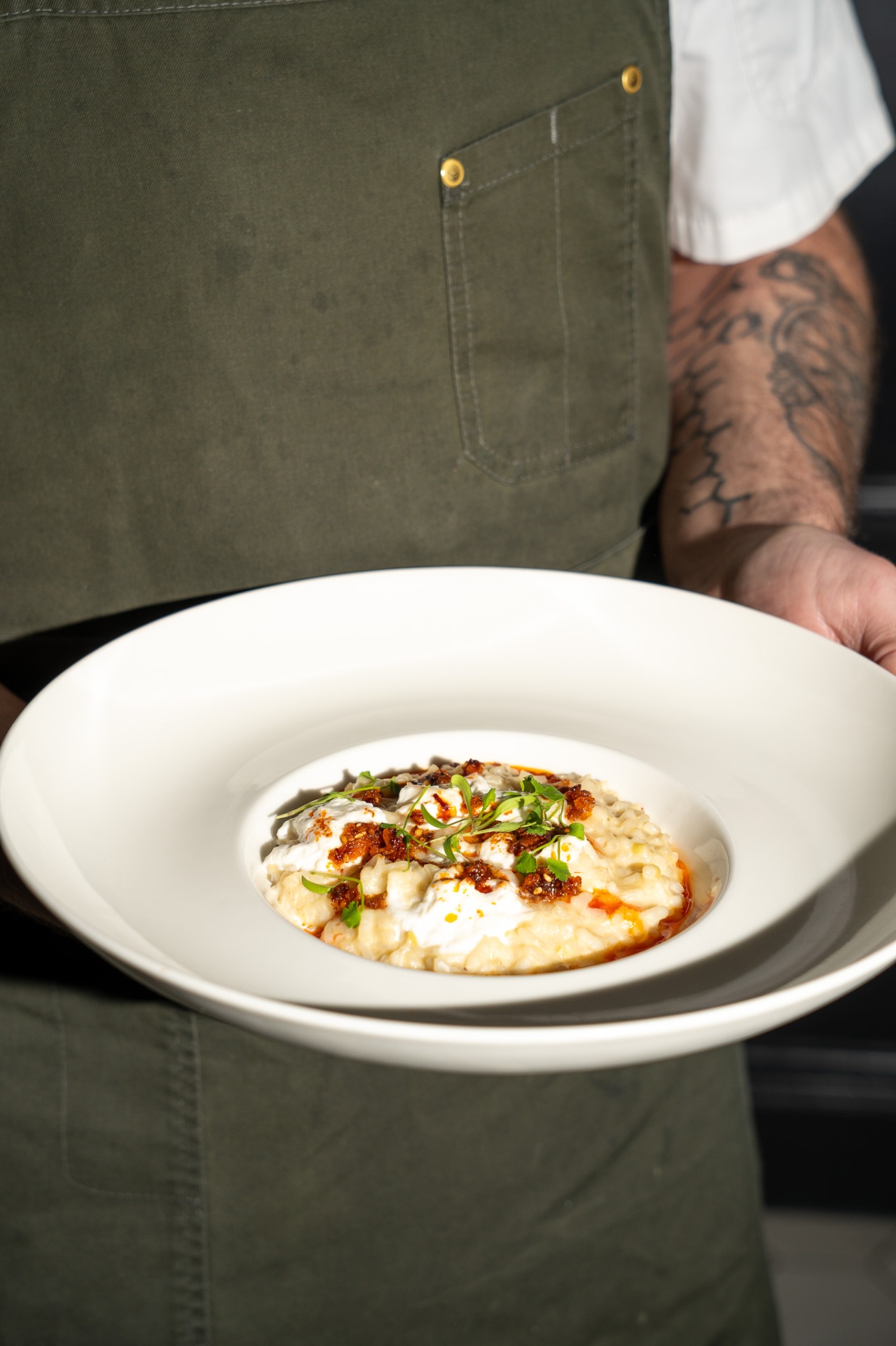 Chef presenting a signature dish
